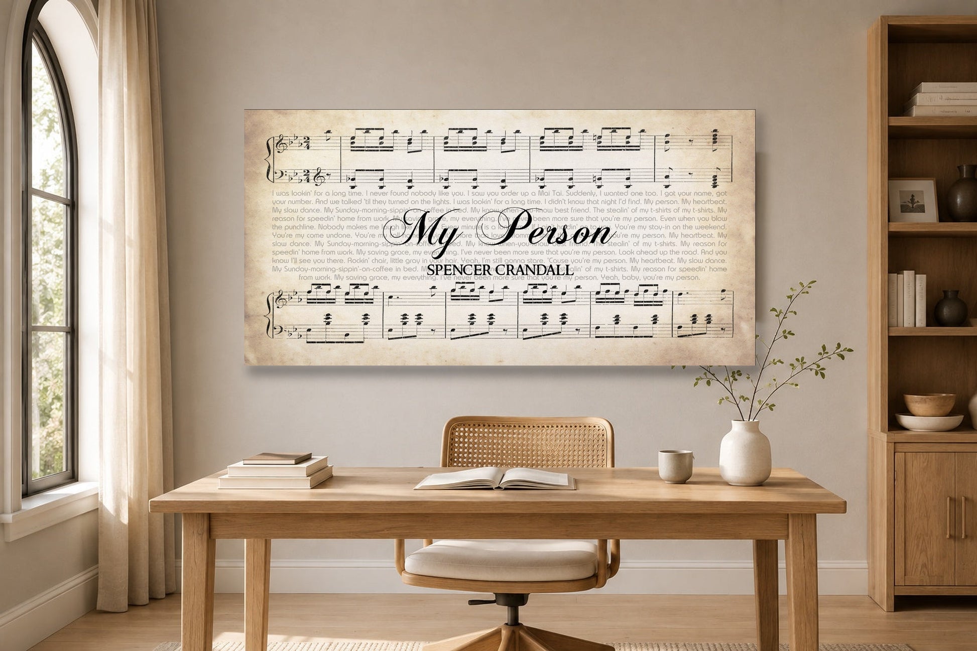 Personalized My Person sheet music canvas in a sunlit white oak home office with an arched window