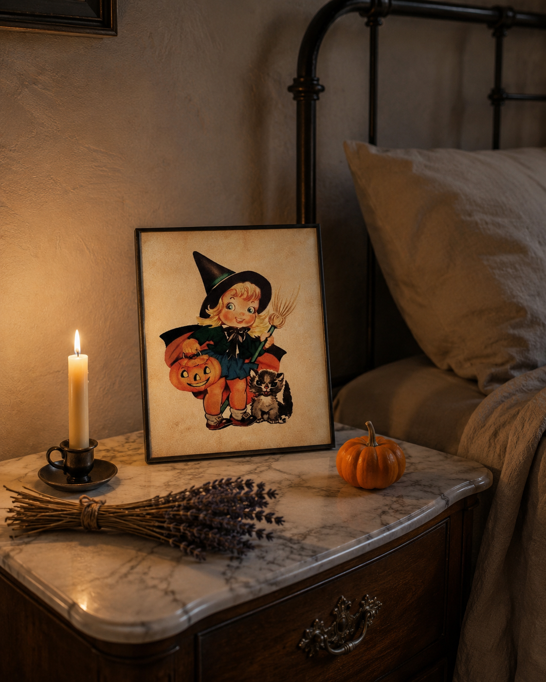 Vintage Halloween 8x10 print framed on marble nightstand with taper candle, dried lavender and small pumpkin