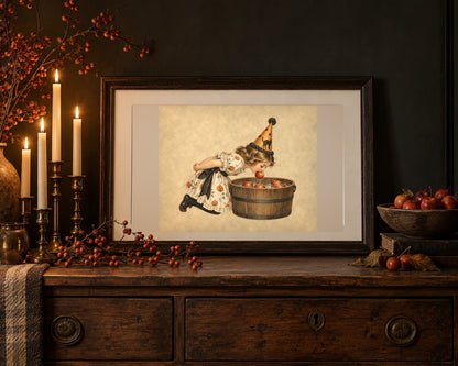 Vintage Halloween apple bobbing print on an oak dresser with taper candles and crab apples