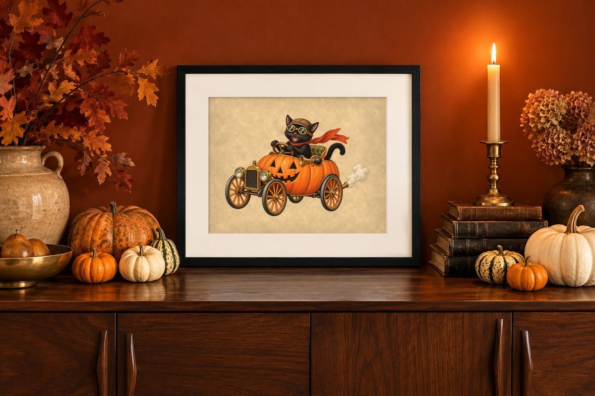 Framed black cat pumpkin car print on a walnut sideboard against a burnt-orange wall