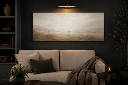 David and Goliath Christian canvas above a cream linen sofa in a charcoal living room with brass picture light