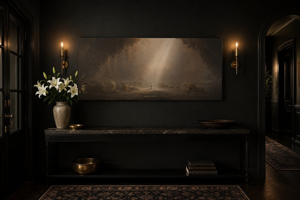 Daniel in the Lions Den canvas above a black entryway console with brass sconces