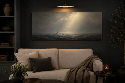 Jonah and the Whale canvas above a cream linen sofa in a charcoal living room with brass picture light