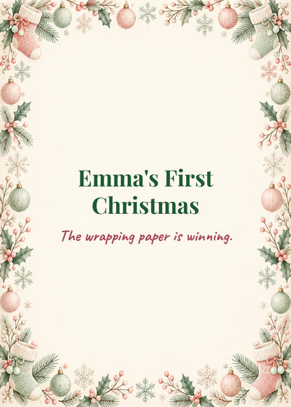 Card cover: Emma's First Christmas, the wrapping paper is winning