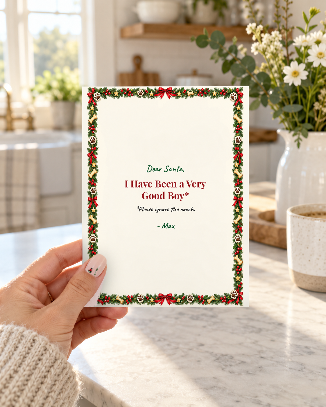 Hand holding funny Christmas card from the dog, Dear Santa I have been a very good boy