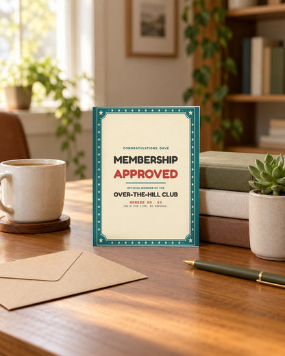 Membership approved birthday card standing on a desk with an envelope