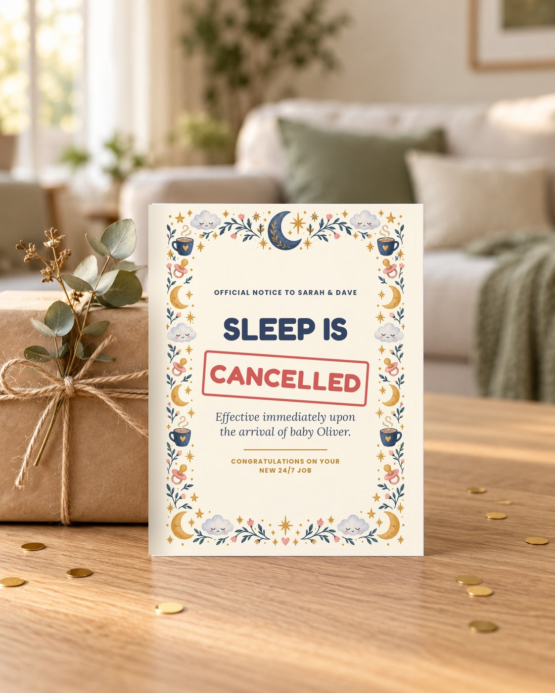 Sleep Is Cancelled card leaning on a wrapped gift