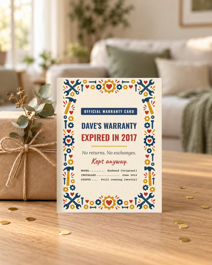 Husband warranty card leaning on a wrapped gift
