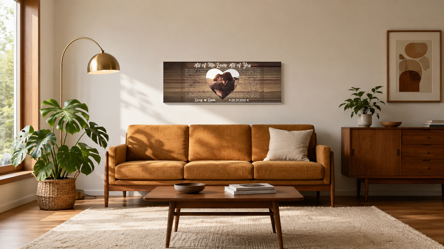 Custom first dance song lyrics panoramic canvas hanging above a walnut mid-century sofa in a sunlit living room