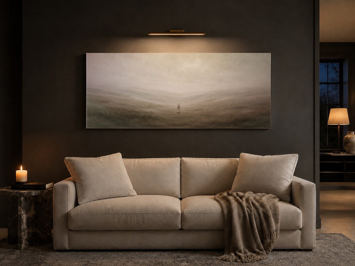 Good Shepherd canvas above a cream sofa in a charcoal living room