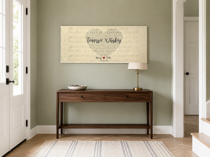 Anniversary heart lyric canvas above a walnut console table on a sage green entryway wall