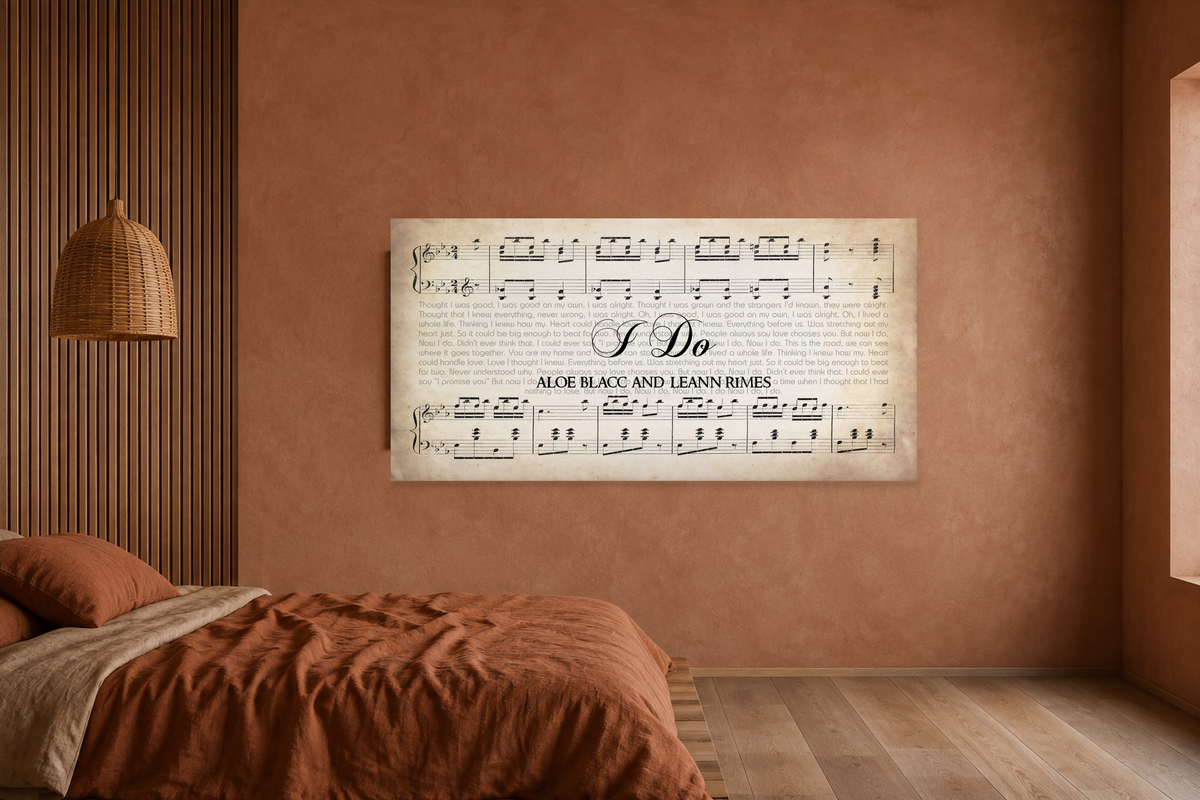 I Do song lyrics canvas on a terracotta plaster bedroom wall with rust linen bedding and a walnut slat panel