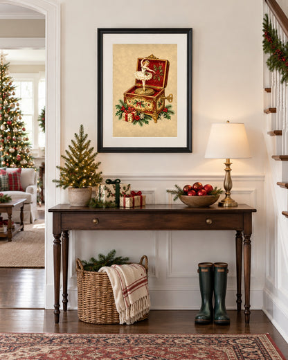 Framed vintage Christmas music box print above an entryway console with mini tree