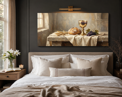 Communion bread and chalice canvas hung above a modern neutral bed