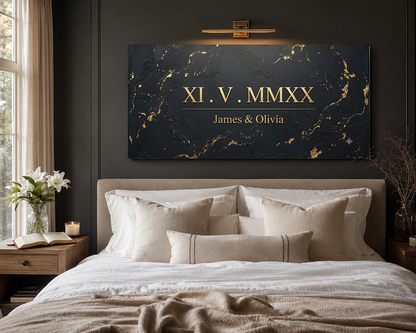 Roman numeral anniversary canvas hung above a modern neutral bed