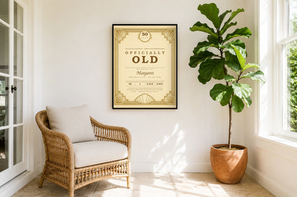 Officially Old birthday award print framed in a bright sunroom