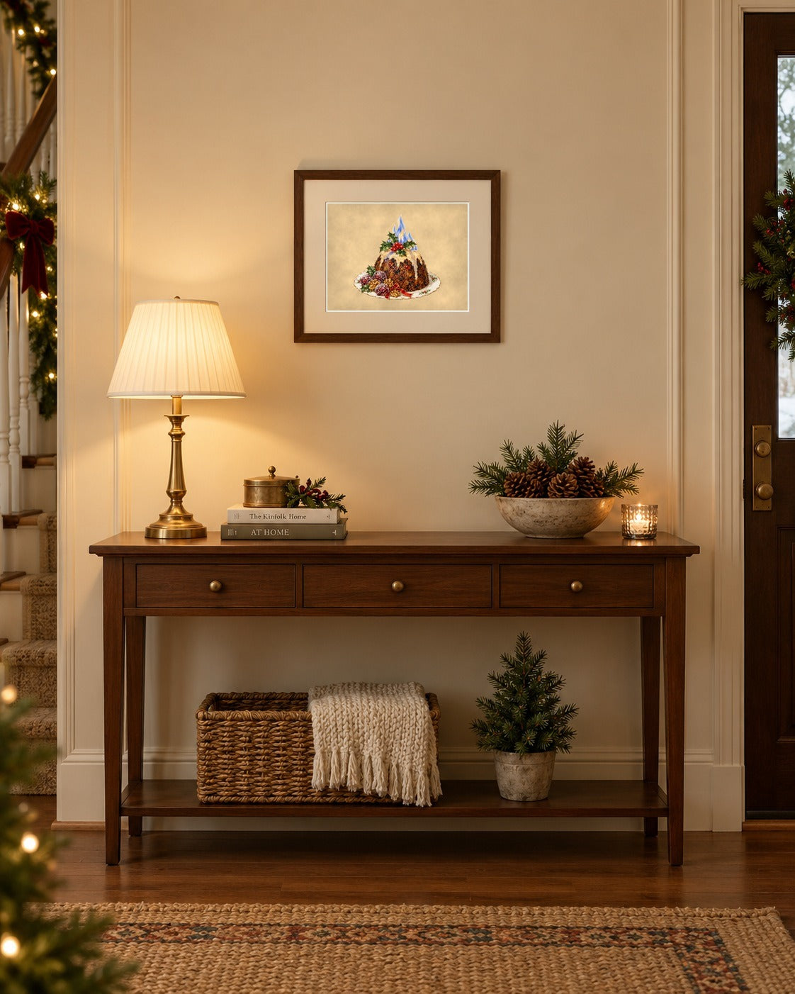 Vintage Christmas plum pudding 10x8 print framed above an entryway console with lamp and pine cones