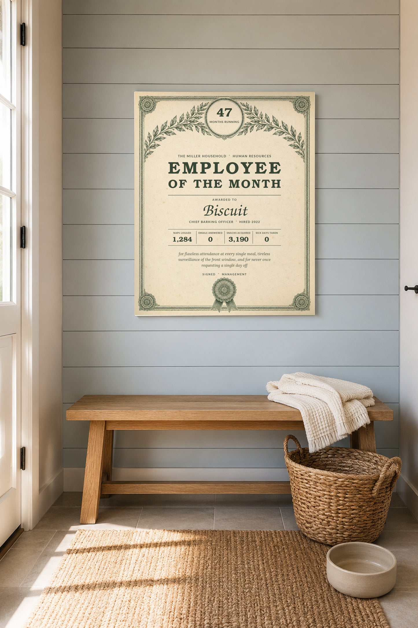 Personalized pet Employee of the Month award print hanging in a light entryway above a bench