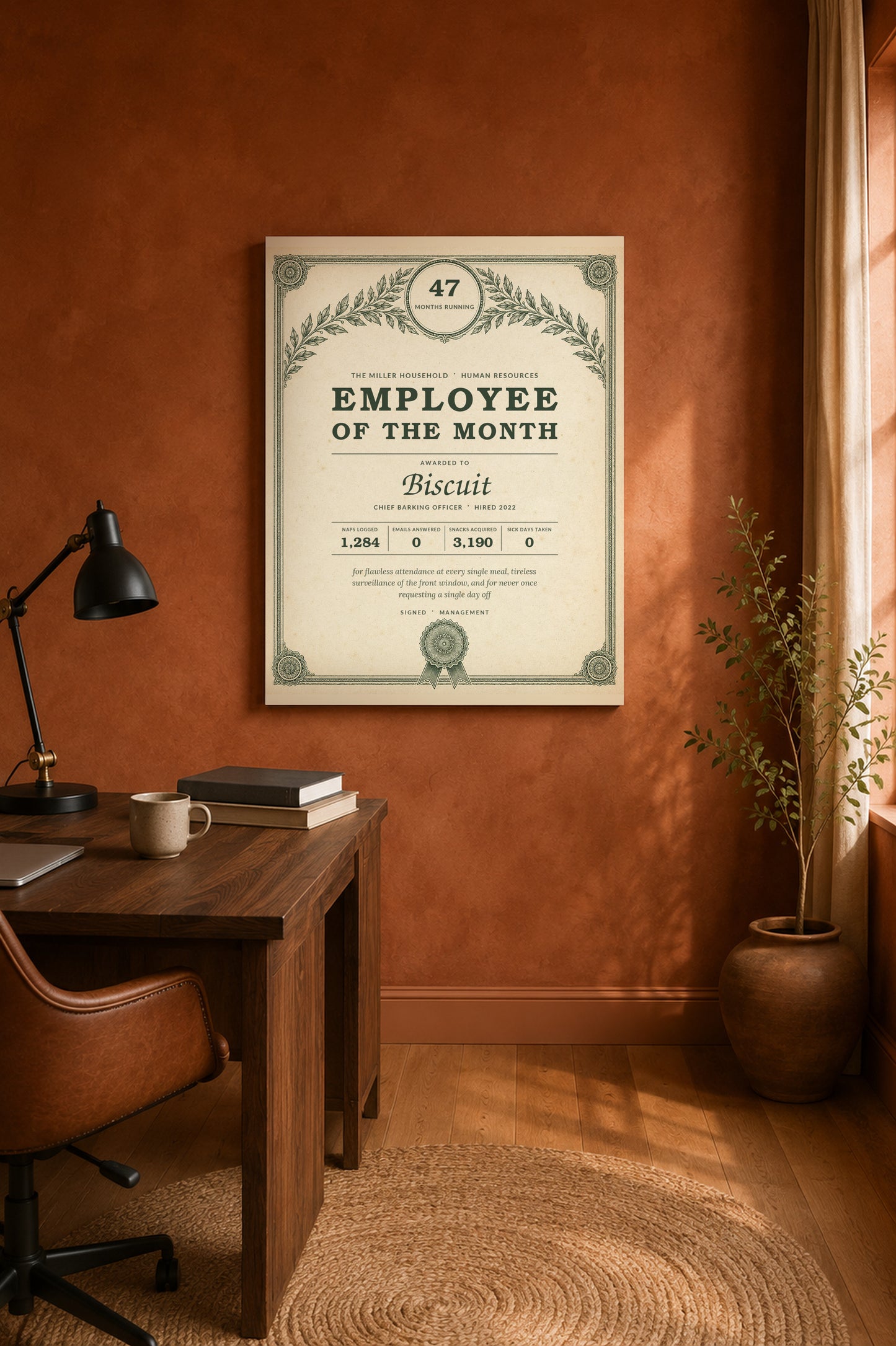 Pet Employee of the Month print on a terracotta home office wall above a walnut desk
