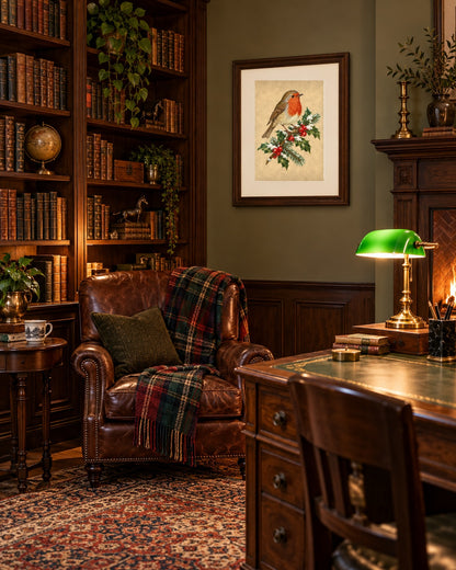 Vintage Christmas robin print framed in a study with bookshelves