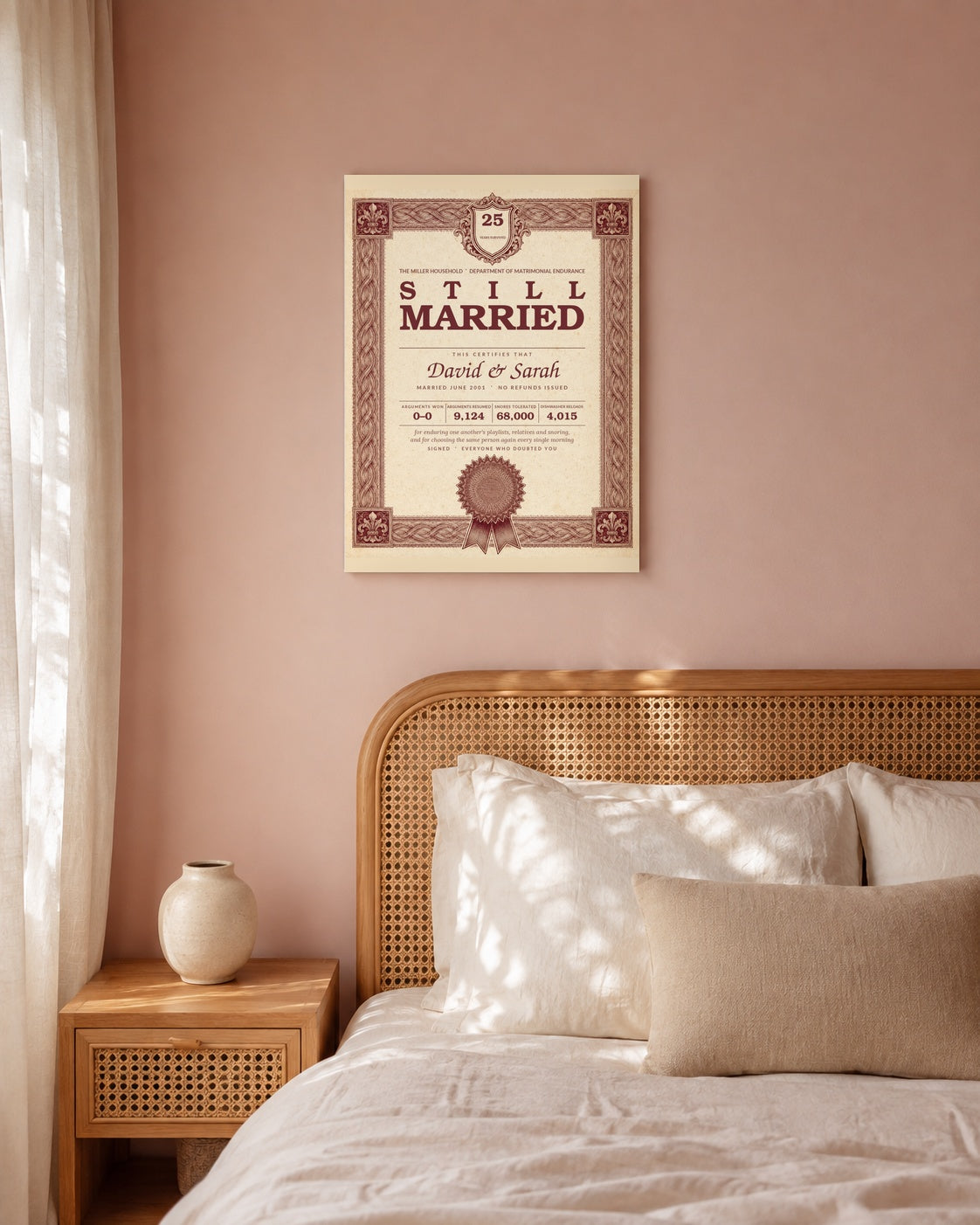 Personalized anniversary roast wall art above a cane bed in a blush pink bedroom