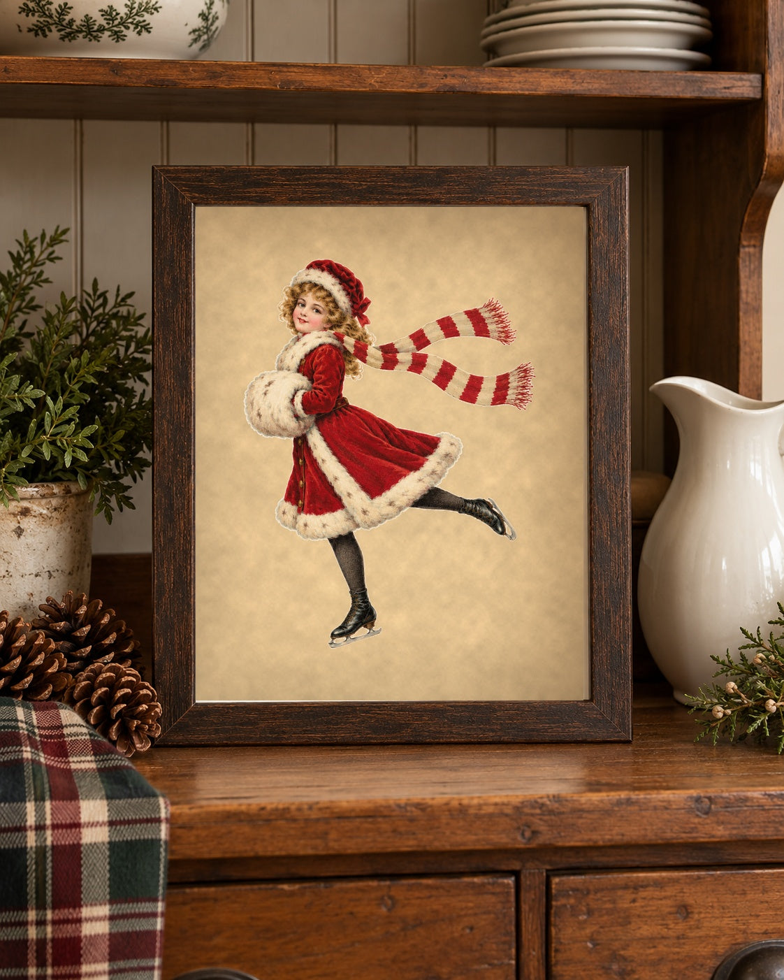 Vintage Christmas ice skater print framed on a farmhouse kitchen hutch