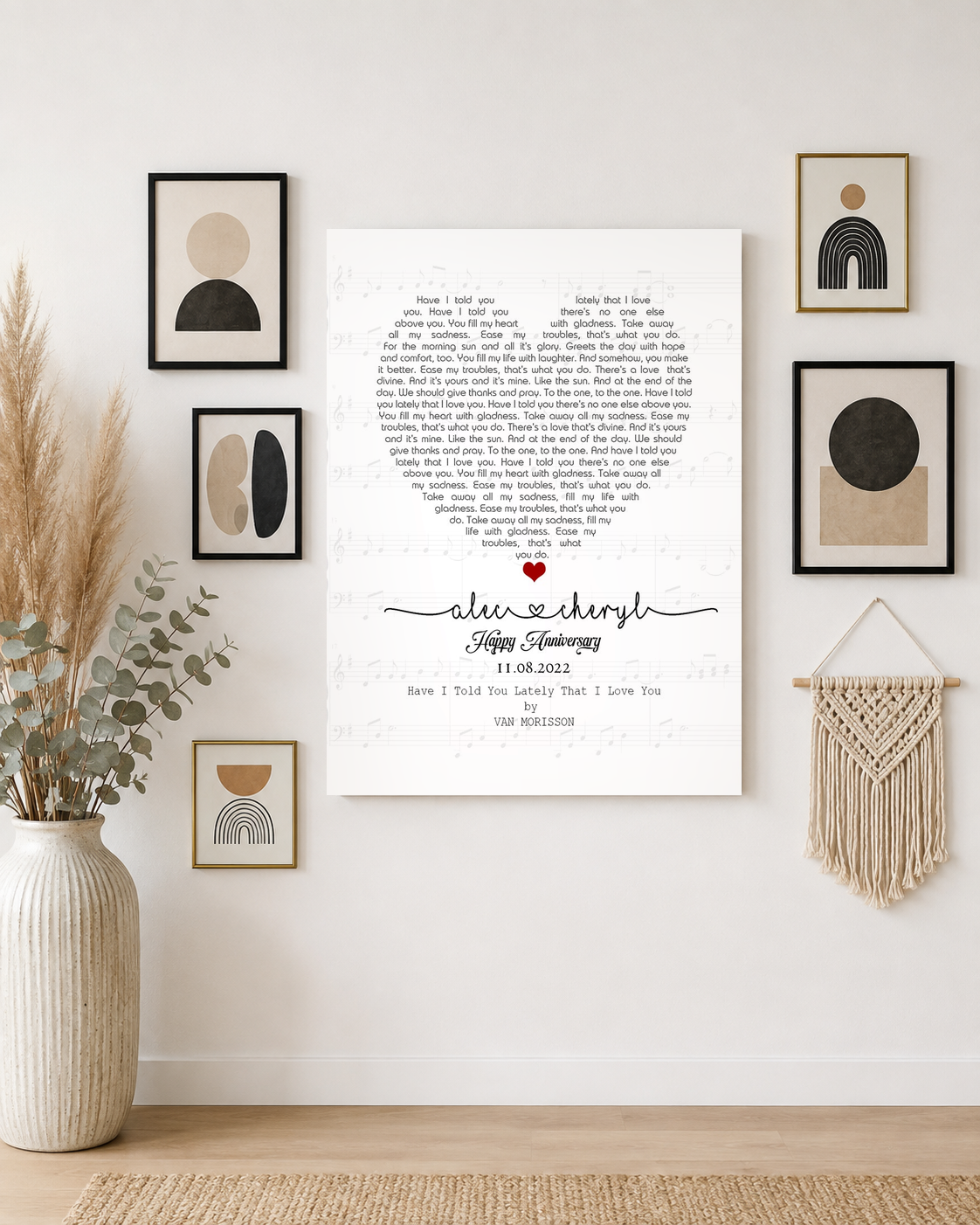 Custom couple names and date song lyrics print as the centrepiece of a modern boho gallery wall with pampas and macrame