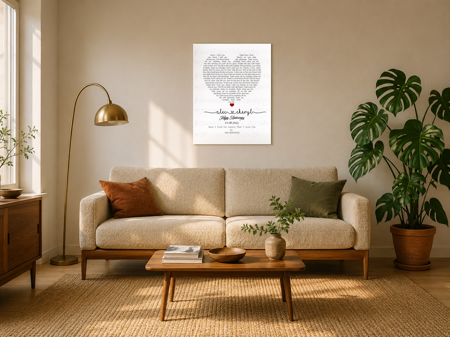 Personalized anniversary song lyrics canvas with couple names and date hanging above a boucle sofa in a sunlit mid-century living room