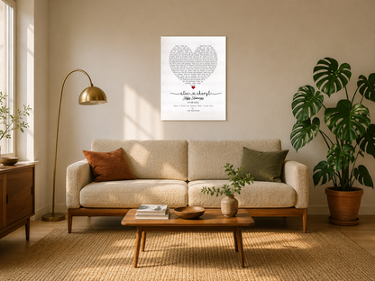 Personalized anniversary song lyrics canvas with couple names and date hanging above a boucle sofa in a sunlit mid-century living room
