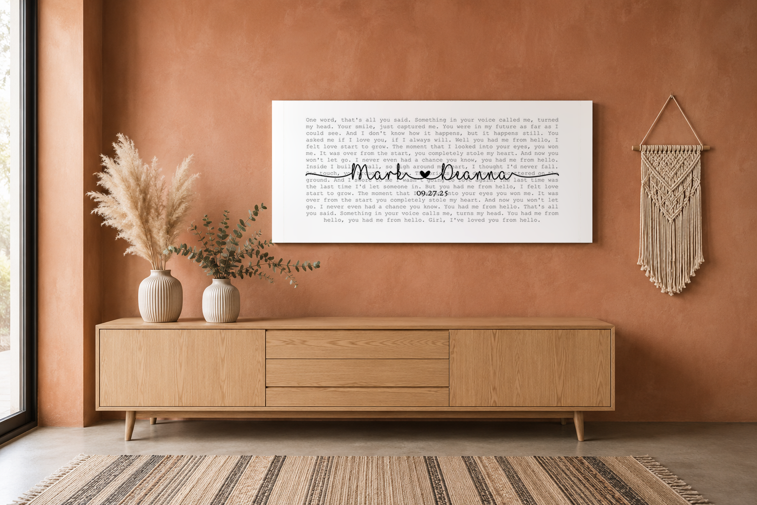 Panoramic song lyric wall art above an oak credenza on a clay limewash boho wall