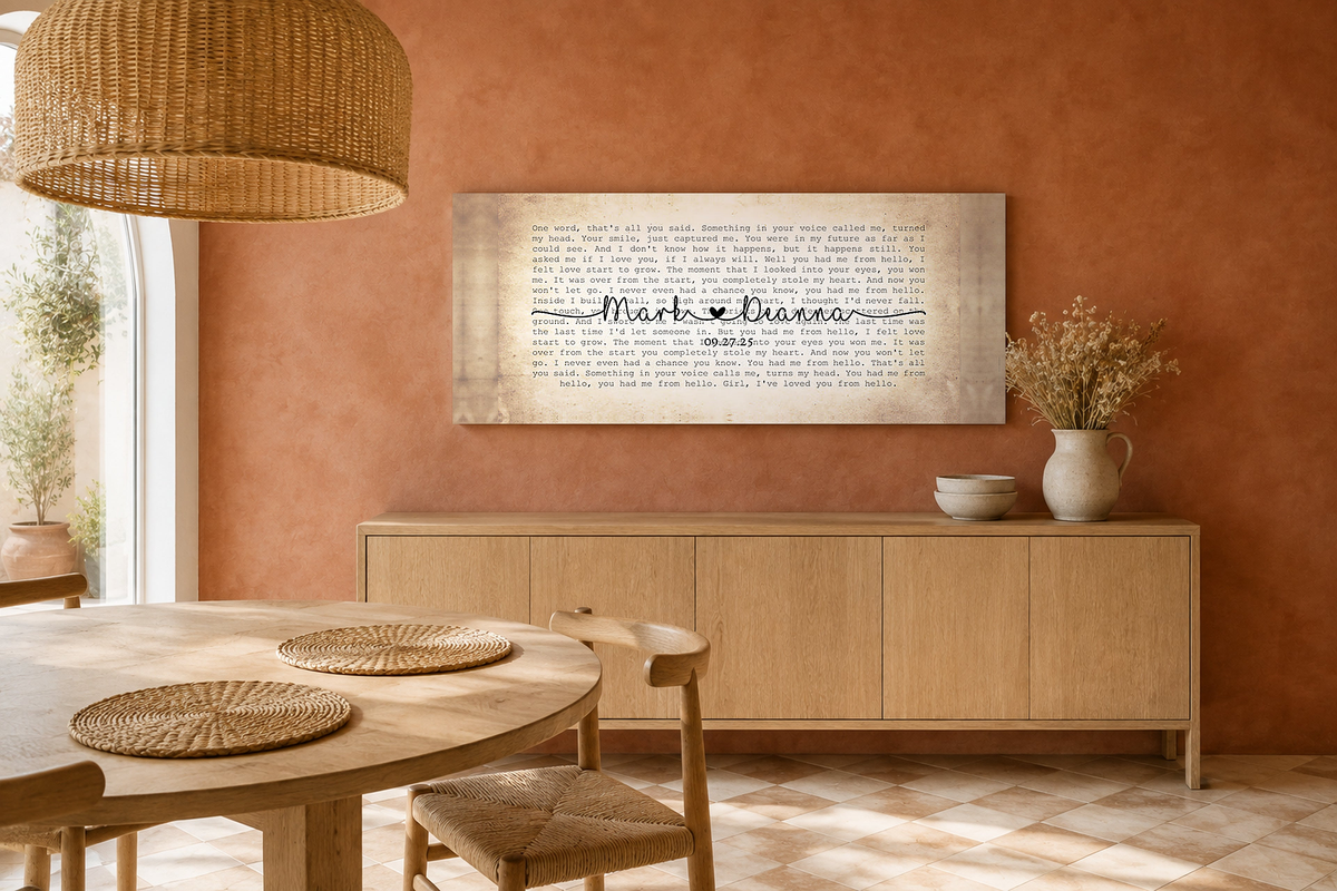 Panoramic wedding song lyric wall art on a terracotta limewash wall above a light oak sideboard in a bright boho dining room