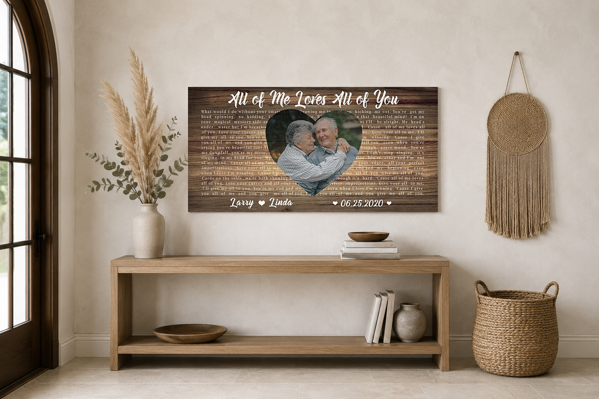 Custom wedding song lyric heart photo canvas above an oak console with pampas grass in a boho entryway
