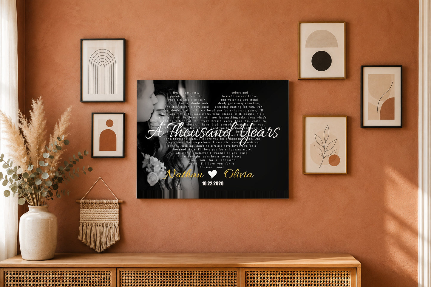 Custom couple names and date song lyrics canvas on a terracotta boho gallery wall with pampas grass and eucalyptus