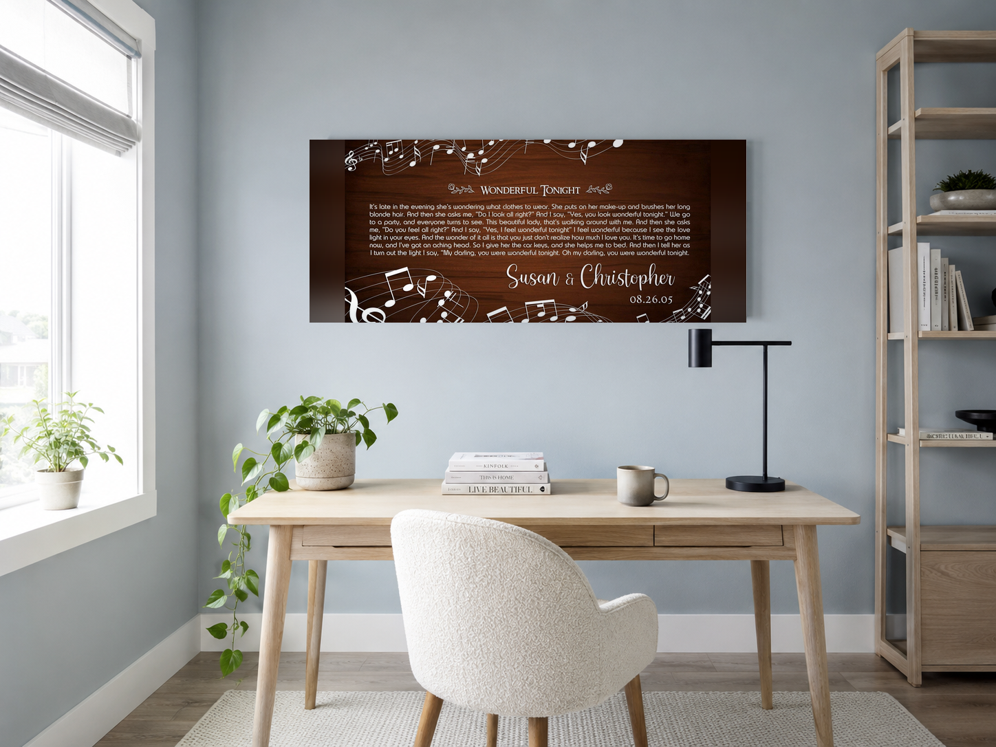 Custom music notes lyric wall art above a white oak desk in a dusty blue scandinavian home office
