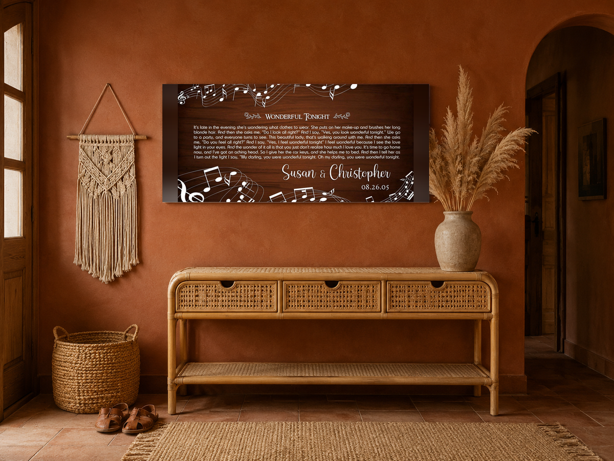 Personalized first dance song lyrics panoramic canvas above a rattan console in a terracotta boho entryway
