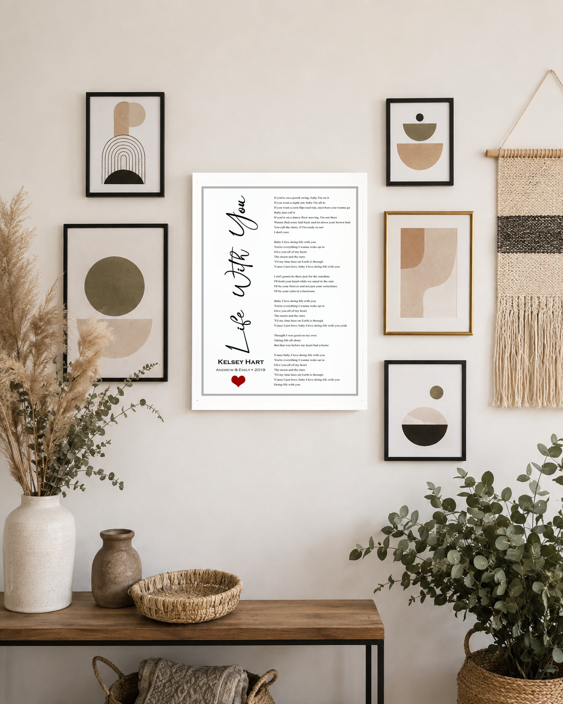 Custom song lyric print as the centerpiece of a modern boho gallery wall with dried flowers