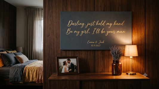 Song Lyric Canvas — 'Perfect' by Ed Sheeran, personalized 'Emma & Jack 10.14.2023', charcoal canvas with gold cursive in warm walnut bedroom (draft preview)