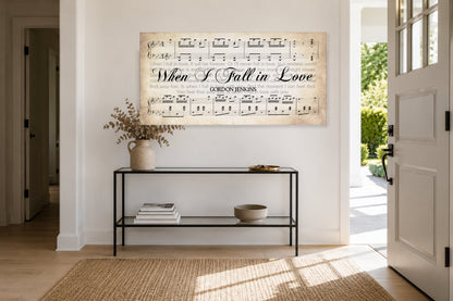 When I Fall in Love panoramic canvas above a slim black console in a sunlit entryway