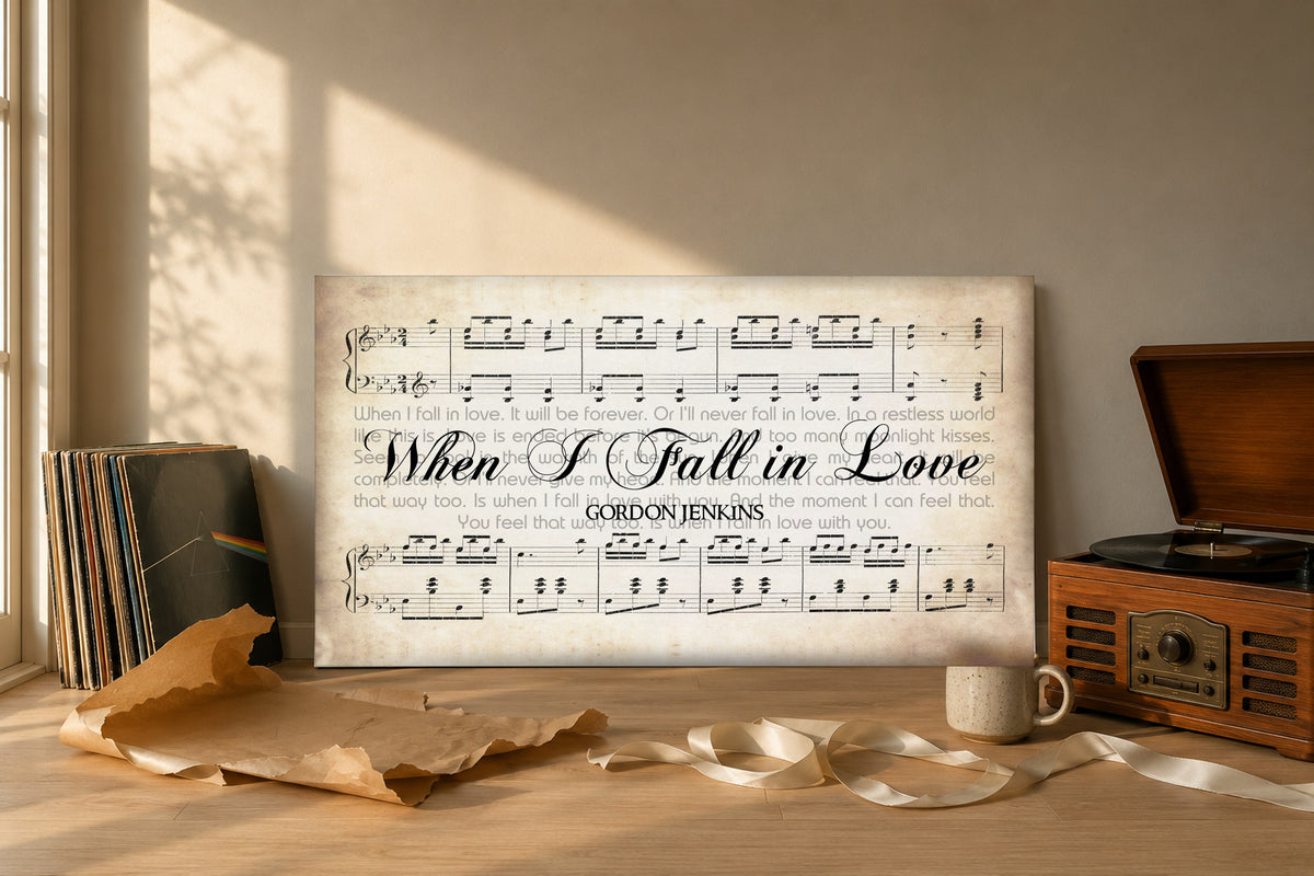 When I Fall in Love canvas gift reveal with kraft paper, ribbon and vinyl records in golden hour light