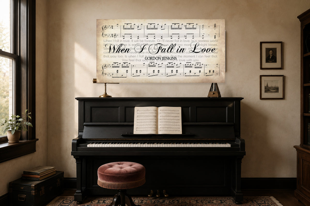 When I Fall in Love lyrics canvas hanging above a black upright piano in a warm plaster music room